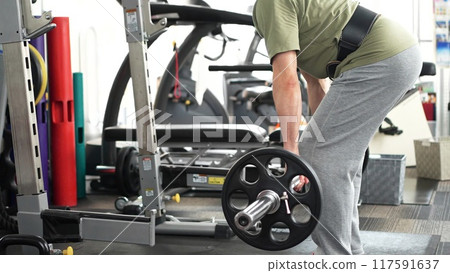 Man working out his whole body with deadlifts Man working out his whole body with deadlifts 117591637