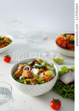 Fried tofu salad in a bowl with vegetables 117591924