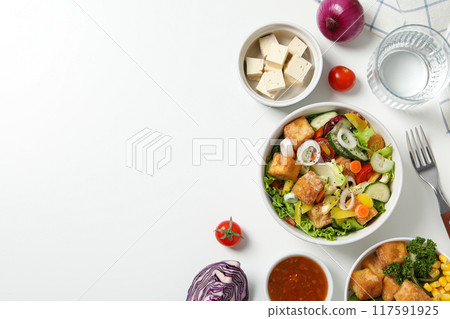 Fried tofu salad with vegetables and sauce top view Fried tofu salad with vegetables and sauce top view 117591925