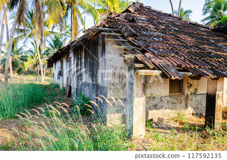 Abandoned tile roof house 117592135