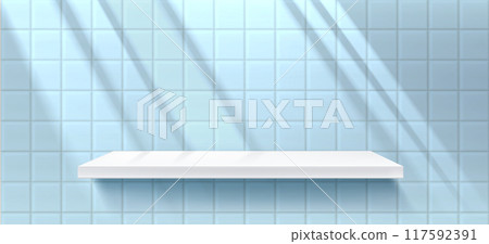 White shelf on blue tile wall with shadow. 117592391