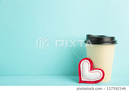 Red heart with beige paper coffee cup on blue. 117592546