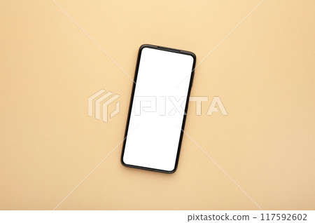Black mobile smartphone with blank screen on beige background. Black mobile smartphone with blank screen on beige background. 117592602