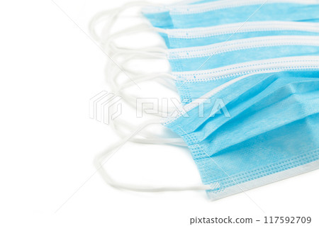 Blue medical face masks isolated on white Blue medical face masks isolated on white 117592709