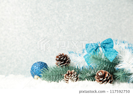 Christmas decoration on a silver glitter background. 117592750