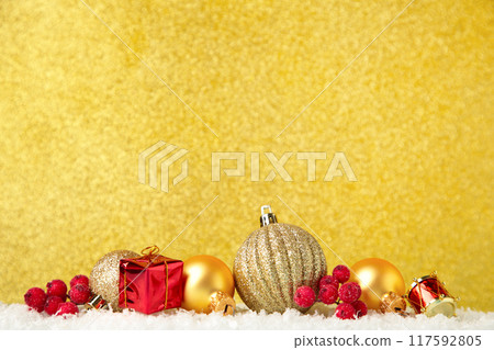 Christmas decorations on a gold glitter background. Christmas decorations on a gold glitter background. 117592805