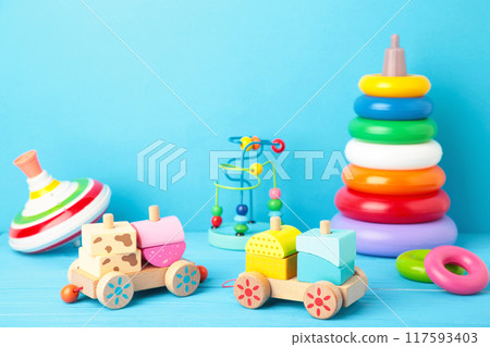 Children's toys collection on a blue background. 117593403