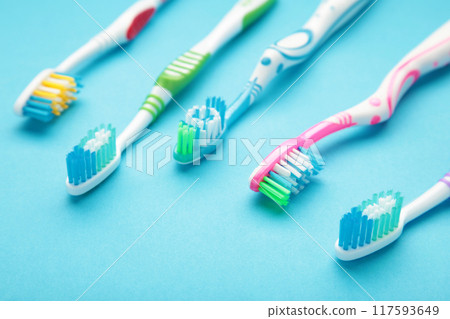 Toothbrushes on blue background with copy space. Toothbrushes on blue background with copy space. 117593649