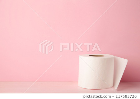 Roll of toilet paper on pink background, top view. 117593726