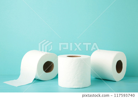 Toilet paper close-up on blue background with copy space 117593740
