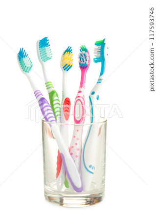 Toothbrushes in glass isolated on white background 117593746