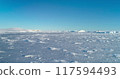 Snow ice field arctic polar environment. Snow-covered Antarctica ocean, frozen wild nature beauty. Untouched landscape under blue sky. Majestic winter scene. South Pole travel background. Low angle 117594493
