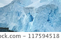 Close up panorama giant blue glacier towering Antarctica polar ocean. A huge iceberg ice wall formation float cold water. Winter landscape background. Ecology melting ice climate change global warming 117594518