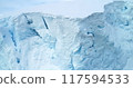 Arctic glacier close up aerial view. Snow covered blue ice wall iceberg in Antarctica, snowy frozen structure. Drone panorama. Natural background, winter wallpaper. Climate change and global warming 117594533