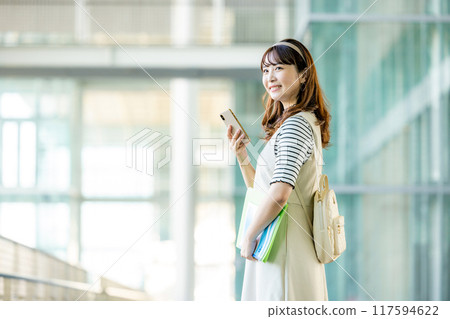 Female college student with smartphone 117594622