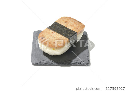 Spam musubi served on a slate plate photographed on a white background Spam musubi served on a slate plate photographed on a white background 117595927
