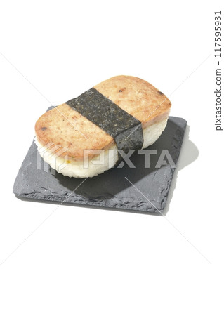 Spam musubi served on a slate plate photographed on a white background Spam musubi served on a slate plate photographed on a white background 117595931