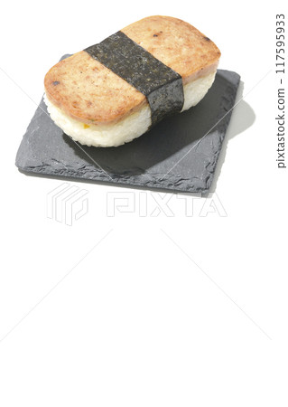 Spam musubi served on a slate plate photographed on a white background 117595933