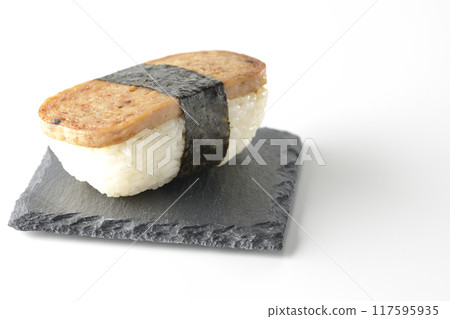 Spam musubi served on a slate plate photographed on a white background 117595935