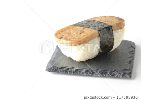 Spam musubi served on a slate plate photographed on a white background 117595936