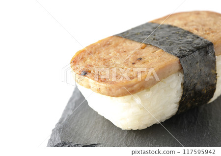Spam musubi served on a slate plate photographed on a white background Spam musubi served on a slate plate photographed on a white background 117595942