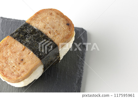 Spam musubi served on a slate plate photographed on a white background Spam musubi served on a slate plate photographed on a white background 117595961