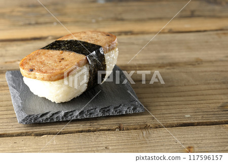 Spam musubi served on a slate plate 117596157