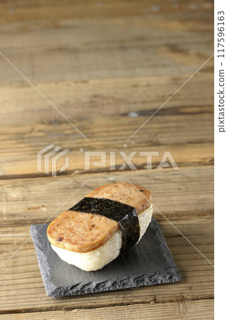 Spam musubi served on a slate plate 117596163
