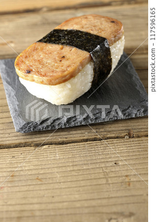 Spam musubi served on a slate plate 117596165
