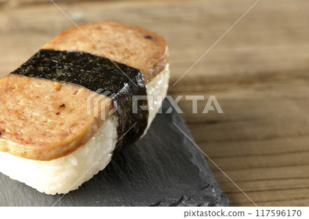 Spam musubi served on a slate plate 117596170