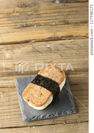 Spam musubi served on a slate plate 117596175