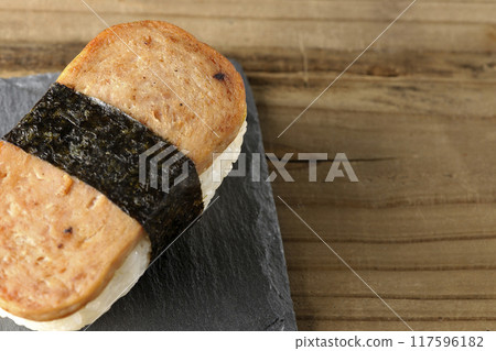 Spam musubi served on a slate plate 117596182