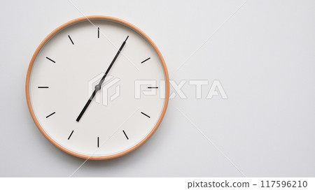 Minimalist wooden Wall Clock on White Wooden Surface with Space for Text. Time Set at 19.05/07.05 Minimalist wooden Wall Clock on White Wooden Surface with Space for Text. Time Set at 19.05/07.05 117596210
