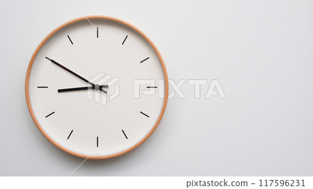 Minimalist wooden Wall Clock on White Wooden Surface with Space for Text. Time Set at 20.50/08.50 Minimalist wooden Wall Clock on White Wooden Surface with Space for Text. Time Set at 20.50/08.50 117596231
