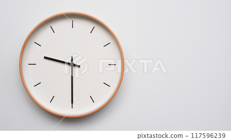Minimalist wooden Wall Clock on White Wooden Surface with Space for Text. Time Set at 21.30/09.30 Minimalist wooden Wall Clock on White Wooden Surface with Space for Text. Time Set at 21.30/09.30 117596239