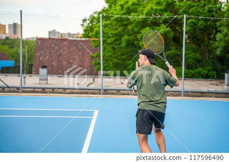 Professional male tennis player playing the tennis on outside court 117596490