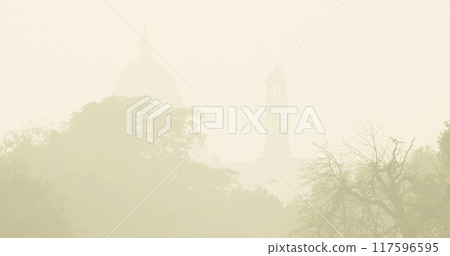 Delhi, India. Silhouette of a Central dome, Bell tower. Secretariat Building or Central Secretariat houses the important ministries of the Government of India. Air pollution is an environmental 117596595