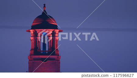 New Delhi, Delhi, India. Close up of Rashtrapati Bhavan, Bell tower in Kartavya Path, Rajpath Area. Rashtrapati Bhavan in evening night illumination lights lighting. Popular Public Space For Tourists New Delhi, Delhi, India. Close up of Rashtrapati Bhavan, Bell tower in Kartavya Path, Rajpath Area. Rashtrapati Bhavan in evening night illumination lights lighting. Popular Public Space For Tourists 117596627