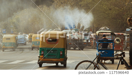 New Delhi, Delhi, India. Fire truck spraying water over Delhi streets amid pollution emergency. The government plans to spray the city with water in an attempt to clear the toxic smog cloud New Delhi, Delhi, India. Fire truck spraying water over Delhi streets amid pollution emergency. The government plans to spray the city with water in an attempt to clear the toxic smog cloud 117596640