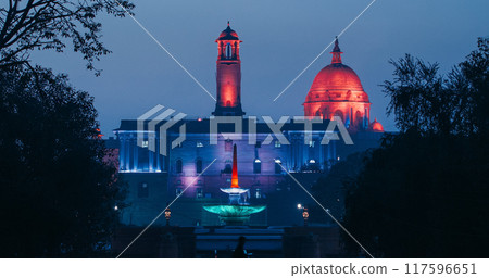 New Delhi, Delhi, India. Kartavya Path, Rajpath Area. Rashtrapati Bhavan - fountain, Bell tower, Central dome of Secretariat Building in evening night illumination lights lighting. City Central Park New Delhi, Delhi, India. Kartavya Path, Rajpath Area. Rashtrapati Bhavan - fountain, Bell tower, Central dome of Secretariat Building in evening night illumination lights lighting. City Central Park 117596651