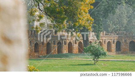 New Delhi, Delhi, India. Old wall surrounded Isa Khan's Tomb near The Humayun's tomb. Famous place is Tomb of Mughal emperor, Mirza Nasir al-Din Muhammad commonly known as Humayun situated in Delhi 117596666