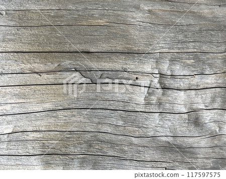 Old weathered grey wooden plank background Old weathered grey wooden plank background 117597575