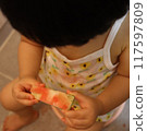 A one-year-old child eating watermelon in summer 117597809