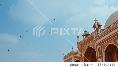 New Delhi, Delhi, India. Birds flying around of Humayun's tomb. Black kite - Milvus migrans - is a bird of prey in the family Accipitridae, which also includes many other diurnal raptors. Famous place 117598418