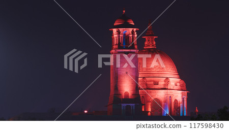 New Delhi, Delhi, India. Close up of Rashtrapati Bhavan, Bell tower and Ministry of External Affairs in Kartavya Path, Rajpath Area. Rashtrapati Bhavan in evening night illumination lights lighting New Delhi, Delhi, India. Close up of Rashtrapati Bhavan, Bell tower and Ministry of External Affairs in Kartavya Path, Rajpath Area. Rashtrapati Bhavan in evening night illumination lights lighting 117598430