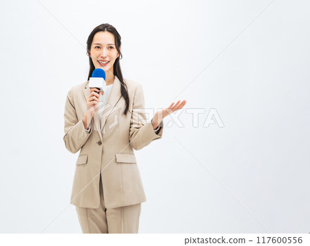 Woman speaking with a microphone 117600556