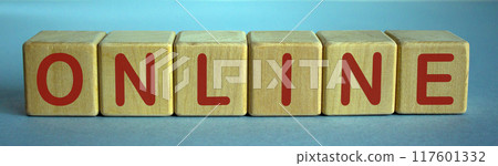 Concept word online on cubes on a beautiful blue background. Concept word online on cubes on a beautiful blue background. 117601332