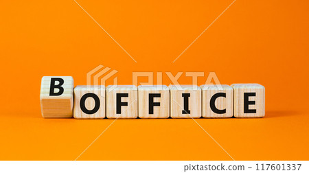 Bed and office it is a boffice symbol. Turned wooden cubes and changed the concept word Office to Boffice. Beautiful orange table orange background. Copy space. Business bed office boffice concept. 117601337