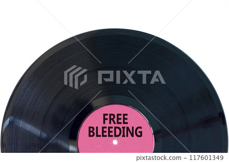 Free bleeding symbol. Concept words Free bleeding on beautiful black old retro vinyl disc. Beautiful white table white background. Gen Z, motivational, freedom free bleeding concept. Copy space. 117601349