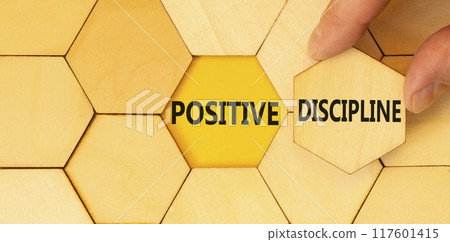 Positive discipline symbol. Concept words Positive discipline on beautiful wooden puzzles. Beautiful yellow paper background. Business psychology positive discipline concept. Copy space. Positive discipline symbol. Concept words Positive discipline on beautiful wooden puzzles. Beautiful yellow paper background. Business psychology positive discipline concept. Copy space. 117601415